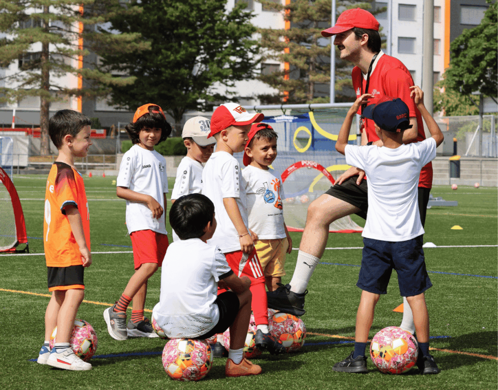 Children participating in a fun coaching session at an InterSoccer Summer Football Camp