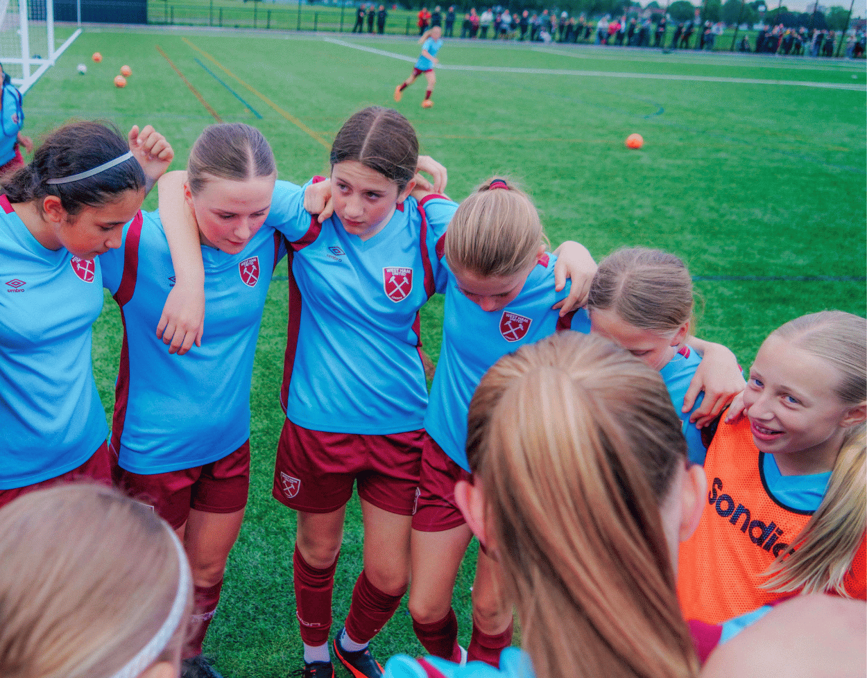 West Ham camp girls in a huddle before an important game