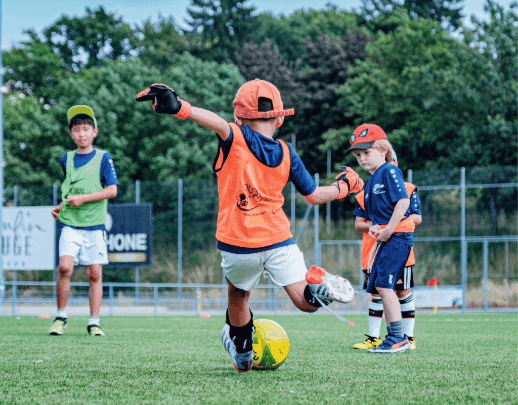 Children enjoying Mini Football Camps Geneva with InterSoccer coaches