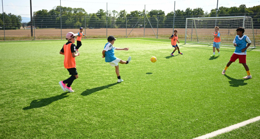 Children playing football during InterSoccer autumn football course