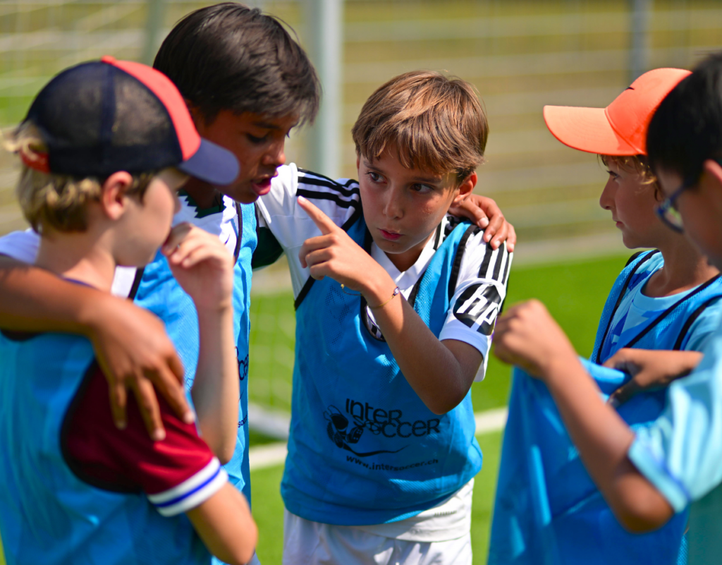 Young players talking together before an Autumn Football Course session