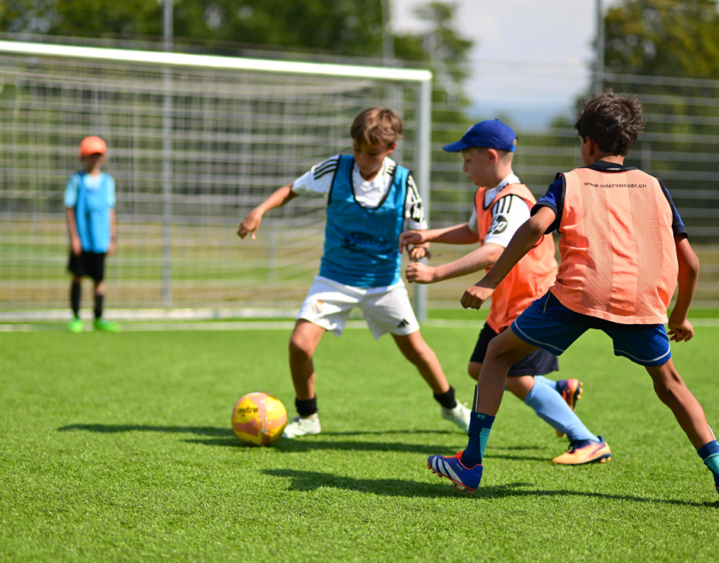 Children playing football during an InterSoccer Free Trial Autumn Course