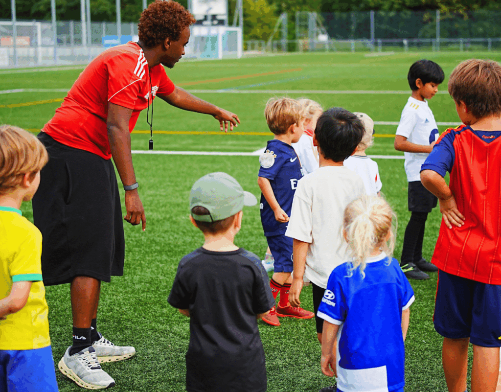 Young players listening to their InterSoccer coach